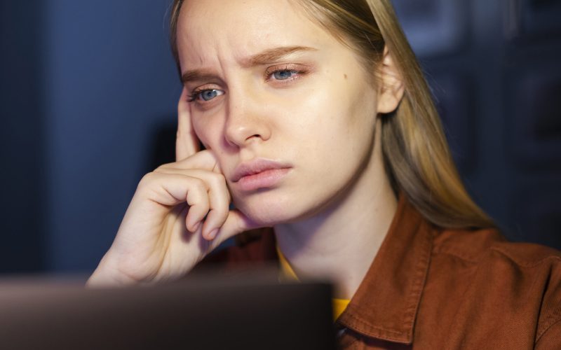 front-view-woman-looking-laptop